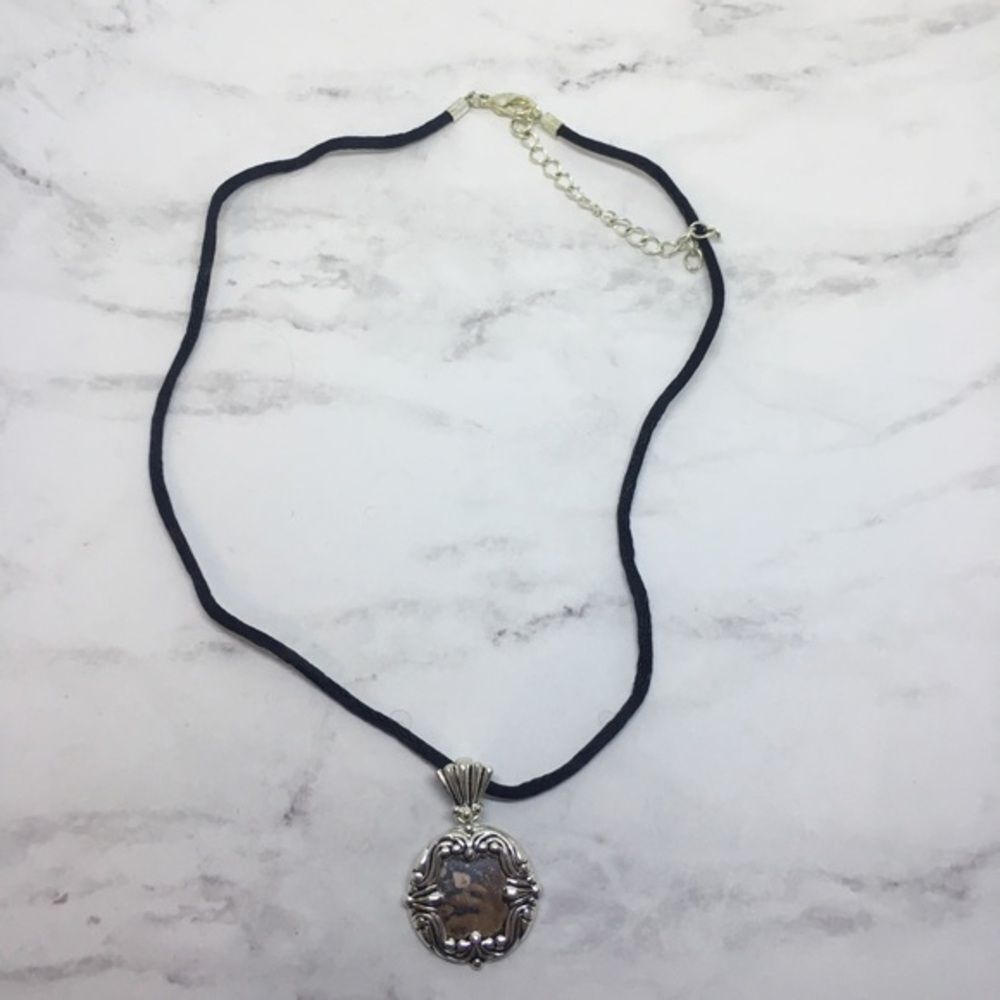 Avon necklace silver tone pendant on black cord